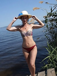 A gallery of women showcasing their legs on a wooden stage