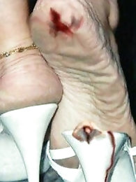 Alluring older woman is fingering her soaked hole