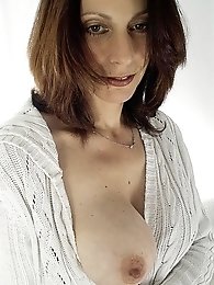 A dirty old lady is playing alone wasting her time